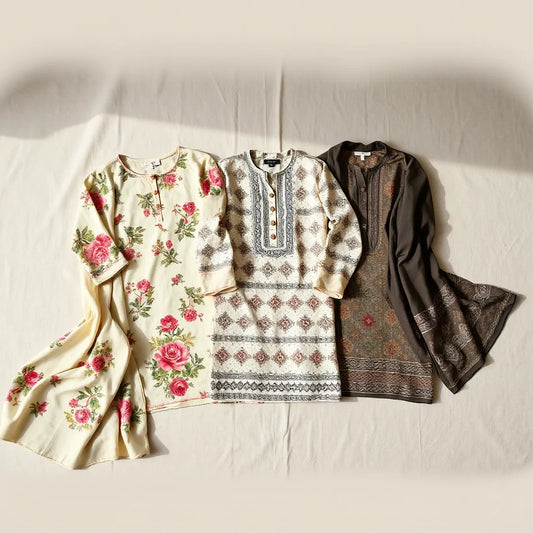 Printed cotton kurtis with vibrant floral and geometric patterns arranged neatly on a neutral background