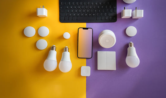 a computer keyboard, light bulbs, and other electronics on a purple and yellow background
