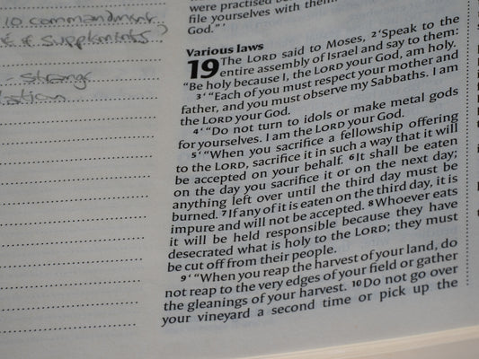 A book page displaying printed text and handwritten notes.