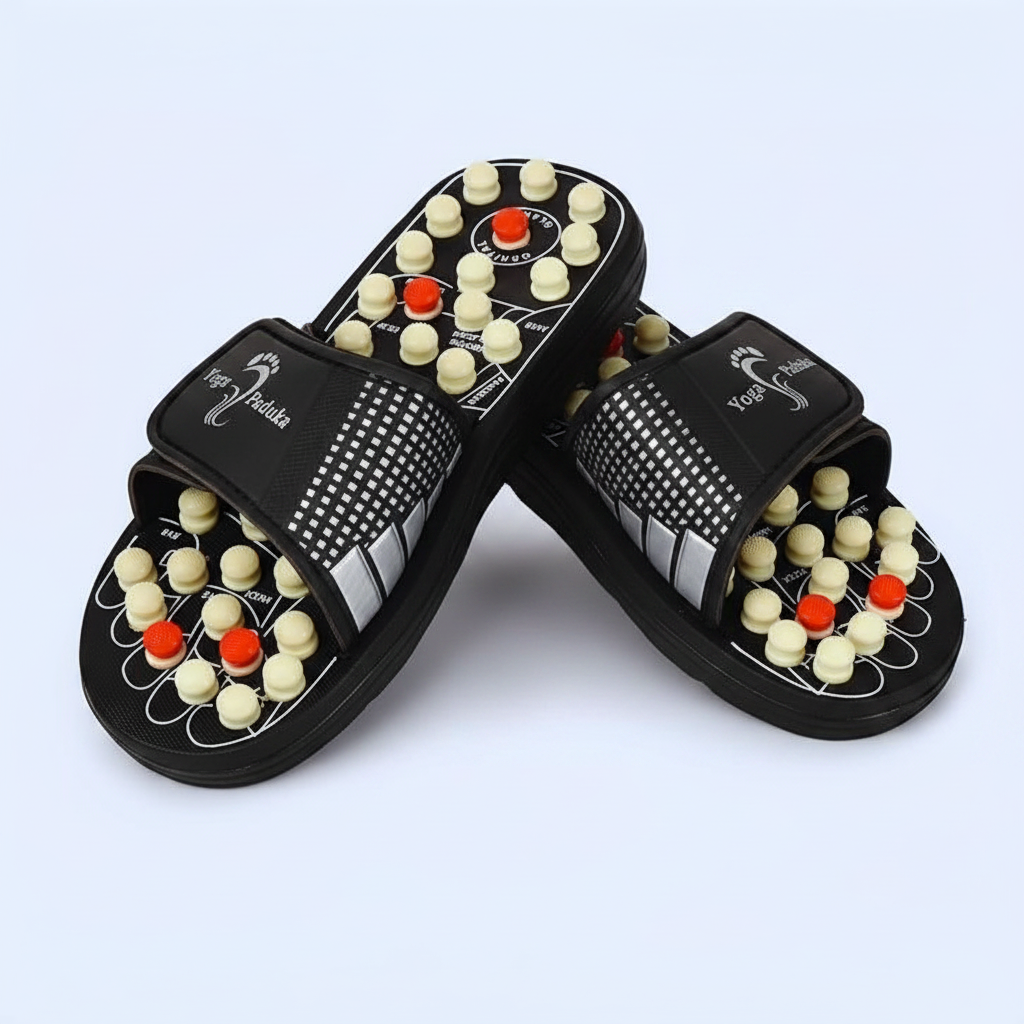 Pair of black yoga paduka slippers with acupressure nodes