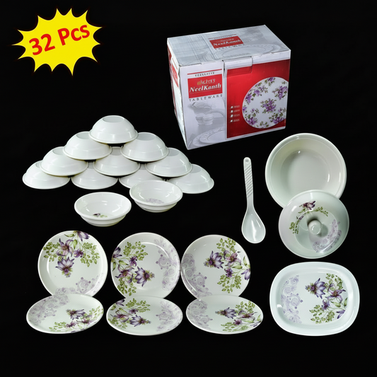 Set of ceramic dishes with floral patterns, including bowls and plates, on a black background.