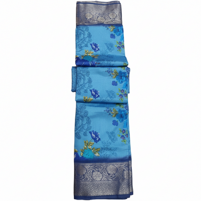 Blue saree with floral patterns and silver border.
