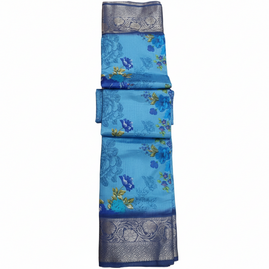 Blue saree with floral patterns and silver border.