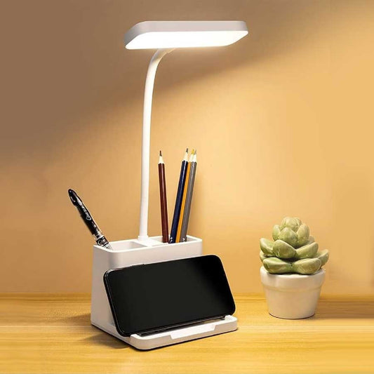 Desk lamp with pen holder and phone stand.